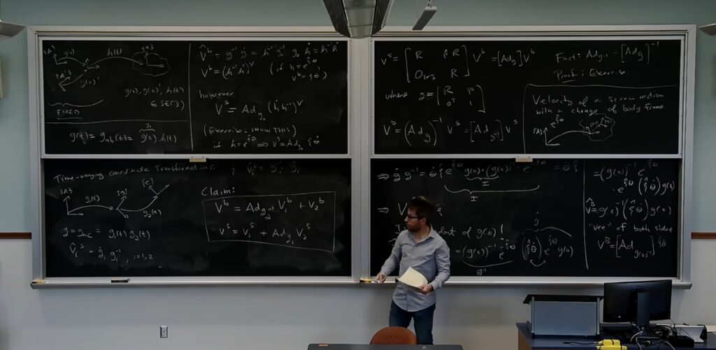 Lecture in progress: chalkboard notes on robotics, dynamics, and control.